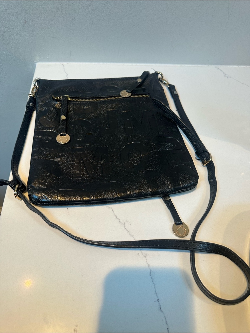Marc Jacob’s Made in Italy Black Crossbody Bag -missing logo plate on front